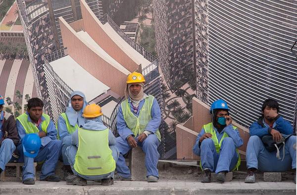 1024px-Migrant_workers_in_West_Bay_Doha